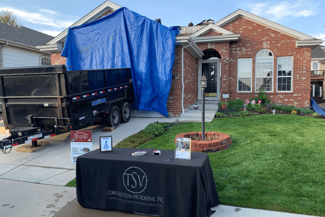 a roofing company fixing a roof