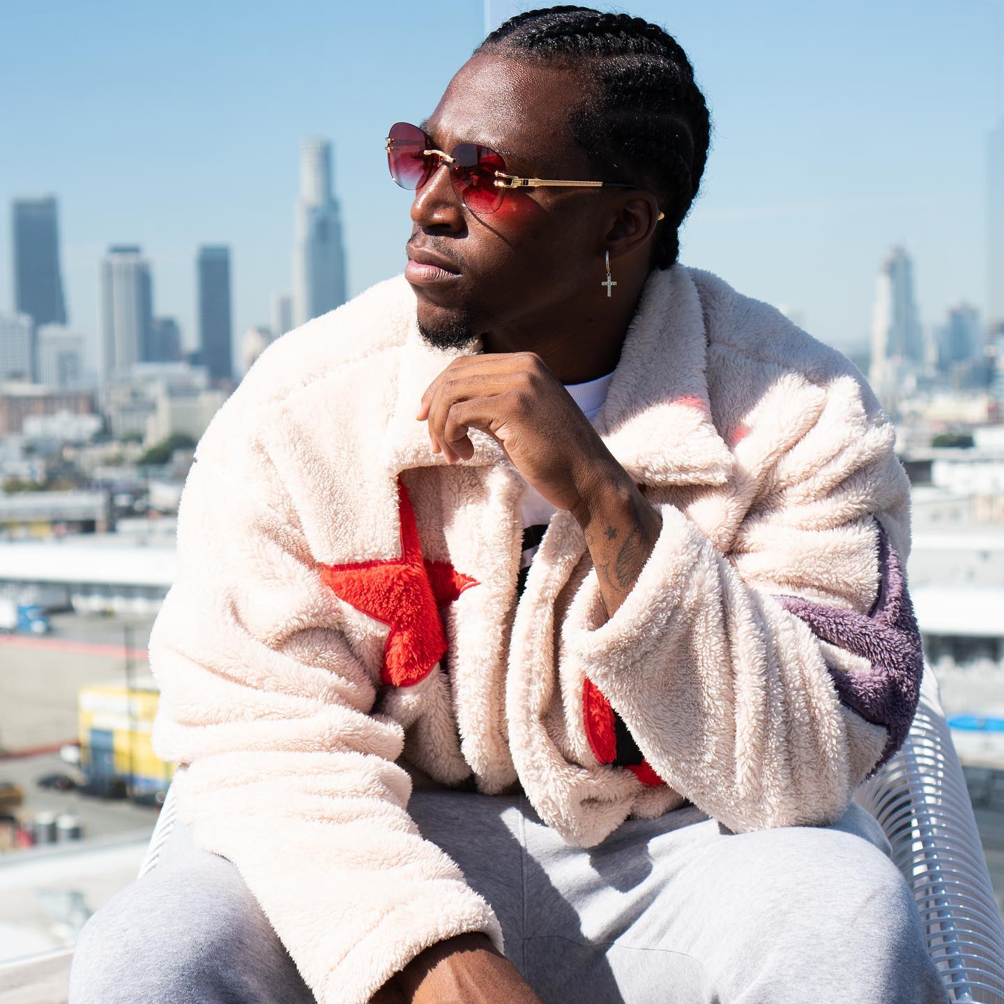 a man showing his red sunglasses